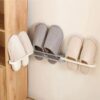 Estante para zapatillas plegable montado en la pared